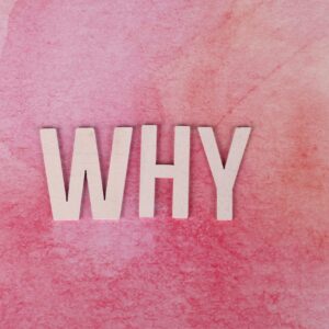 Bold white letters spelling WHY on a pink textured background for conceptual design.